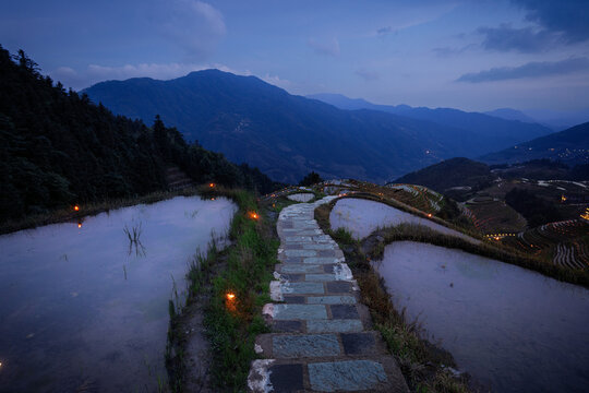 Stone path at Longji Rice Terraces at twilight