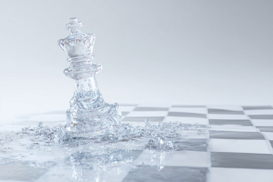 Melting ice chess king on a chessboard. Space for text.