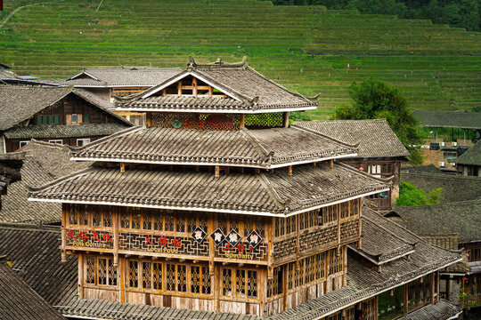 Chinese stilt house village architecture with terraced fields