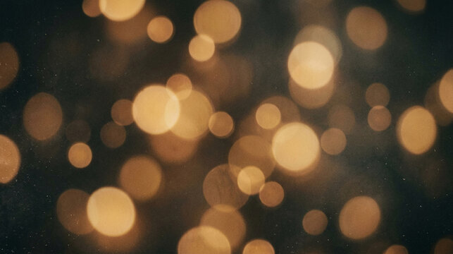 Golden bokeh light orbs on dark blurred background texture with background abstract defocused particle decoration atmosphere radiance illumination celebration beautiful artistic backgrounds