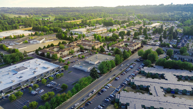 Industrial infrastructure layout interstate 167 curves beside clustered commercial zones within Kent valley. asphalt arterials weave between building arrays, reflecting high traffic logistics, WA