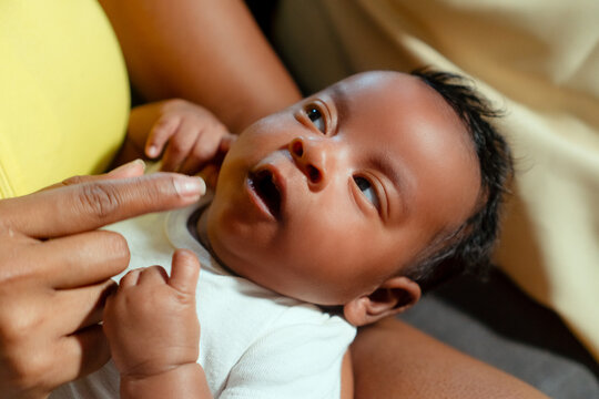 Newborn baby receiving gentle care from parent