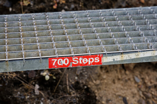 700 Steps Trail Marker on Metal Grated Path