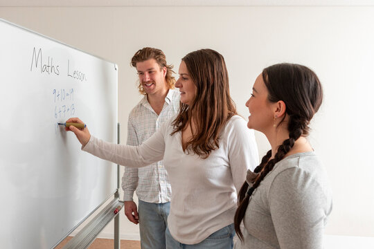 Adult students engaged in a collaborative math lesson
