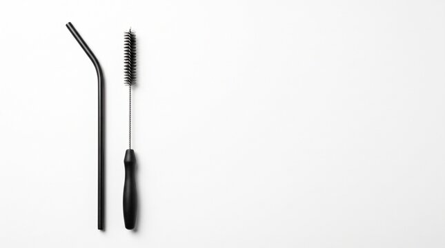 Black Metal Straw and Cleaning Brush on White Background