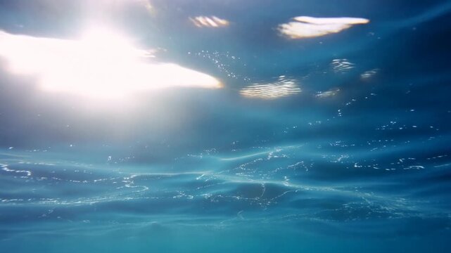 A tranquil underwater scene showcasing clear blue water with shimmering sunlight filtering through, ideal for relaxation and aquatic themes in marketing.