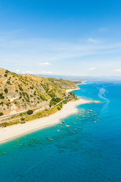 Cliff Bianco with the coast and the blue Mediterranean sea in Calabria, aerial