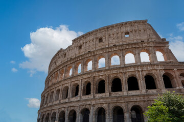 Obraz premium View of Colosseum Rome, Italy on a sunny day with blue sky. The largest amphitheatre ever built. With copy space.