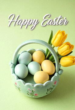 Colorful easter eggs in a decorative basket with yellow tulips for happy easter celebration