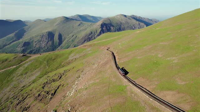 Snowdon Summit Railway, tourist mountain train in the highest peak of Wales. aerial view in summer
