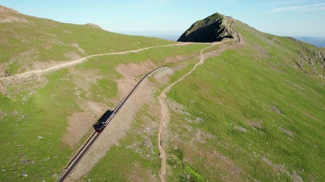 Snowdon Summit Railway, tourist mountain train in the highest peak of Wales. aerial view in summer