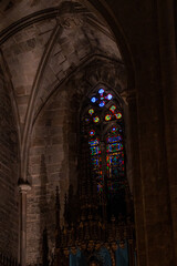 Epic ancient gothic church cathedral interior stone arch vault stained glass vertical.  © Yar