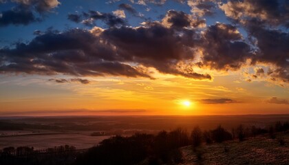 Fototapeta premium Dramatic Sunset Sky With Golden Clouds And Soft Light Over Horizon Landscape