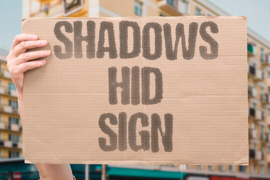 "Shadows Hid Sign" Darkness obscured the crucial marker. SHADOW. HIDE. SIGN. DARKNESS. MARKER.