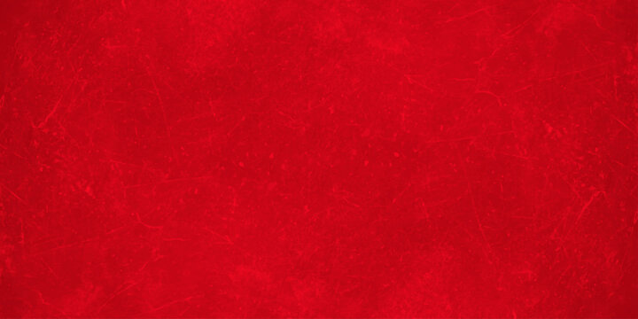 Red grunge texture background with subtle abstract paint scratches and dark vignette borders for festive holiday designs. A textured stone or concrete wall appearance