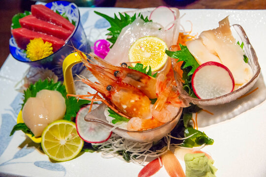 Fresh sashimi platter with tuna, scallop, and spot prawn beautifully arranged