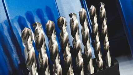 various types drill bits milling cutter. display organized and bits arranged  tech industrial technology background © Aleksandr Matveev