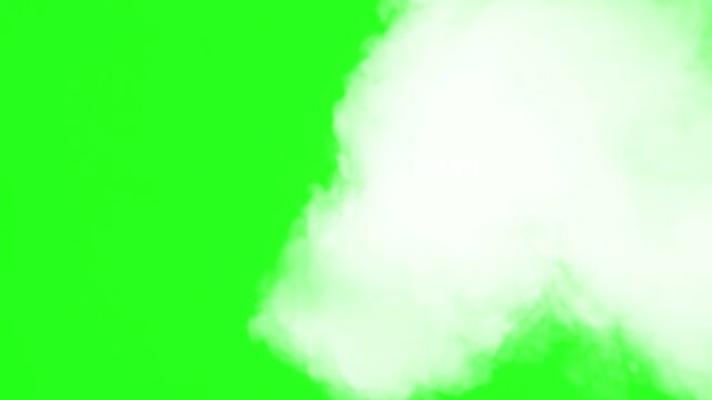 Dense white smoke or fog rising from bottom right corner isolated on chroma key green background mist steam effect overlay cloud