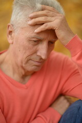 Fototapeta premium elderly man being comforted in a warm indoor setting with a supportive hand on his shoulder, conveying emotional care and family support in a serene and comforting environment.