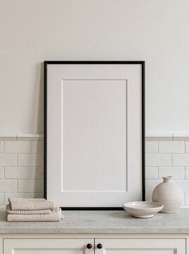 Minimalist blank framed poster mockup on marble kitchen table