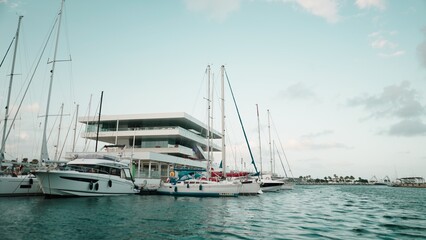 Fototapeta premium Veles e Vents building rising among boats in Valencia marina