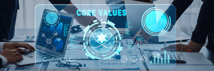 Modern business setting highlighting core values with a digital interface. Team members collaborate over a laptop displaying data analytics and graphs, emphasizing innovation. Trope © InfiniteFlow