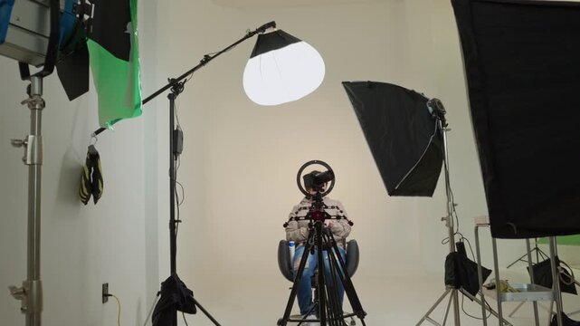 Teenage girl vlogging in professional studio setup