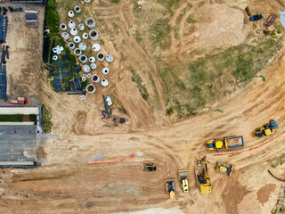 Aerial Top Down View of Infrastructure Site with Construction Equipment and Concrete Pipes © Oak City Drone