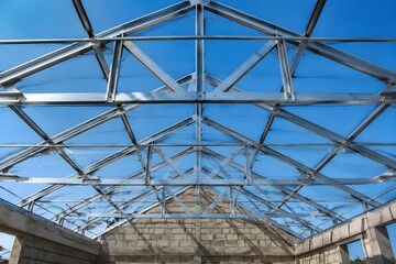 Fototapeta premium Roof Structural Beams Await Final Covering Installation Showcasing Precision Construction Framing and Architectural Engineering Detail