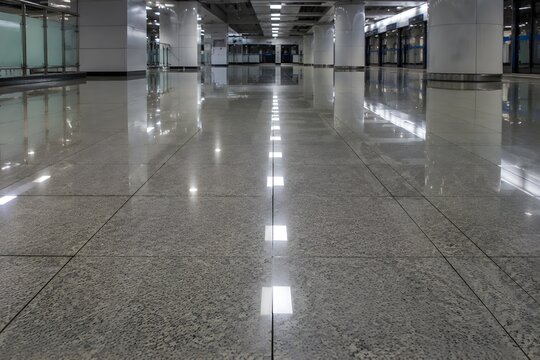 Railway Station Tiled Floor Reflects Overhead Lights After Cleaning in Polished Low Angle View Beautifully