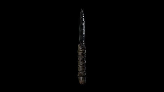 A sharp primitive obsidian knife featuring a glossy dark stone blade and wrapped handle floats vertically against a black background.