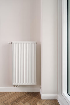 Modern apartment room with a home heating radiator providing warmth in winter