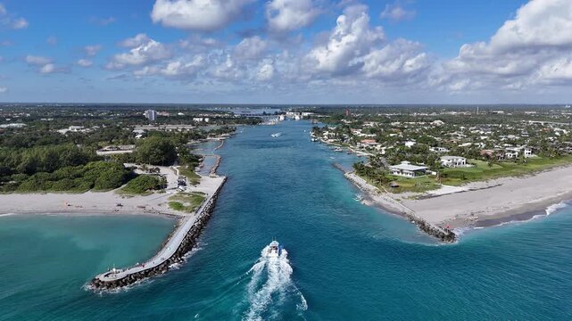 Boat headed back to port from the Atlantic Ocean at Jupiter Inlet in Palm Beach County, Florida.