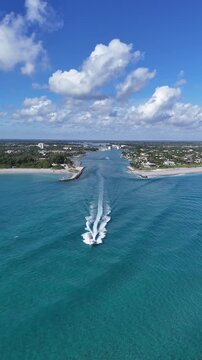 Boat headed into the Atlantic Ocean at Jupiter Inlet in Palm Beach County, Florida. 