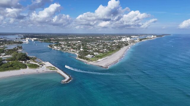 Boat headed back to port from the Atlantic Ocean at Jupiter Inlet in Palm Beach County, Florida.