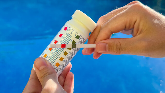 Self-measurement of the water parameters in the pool using test strips. Monitoring the pH of the water, the amount of chlorine and combined chlorine