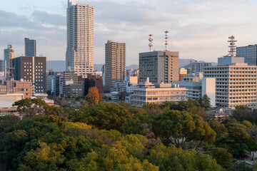 Evening cityscape of Hiroshima with lush urban greenery © STUDIO PAPRIKA