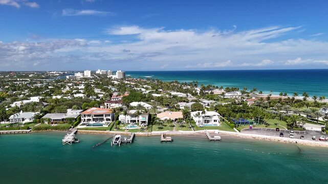 Luxury waterfront homes lining Jupiter Inlet in the town of Jupiter in Palm Beach County, Florida. 