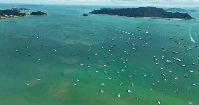 Aerial View Video of Chalong Harbour in Phuket Thailand,Amazing sea with sailing boats and other watercraft on sunny day,Beautiful sea summer good weather day,High angle view