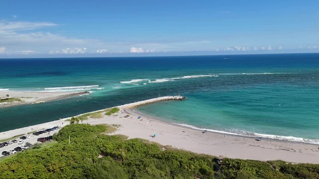 The beach and jetty along Jupiter Inlet at Dubois Park in the town of Jupiter in Palm Beach County, Florida. 