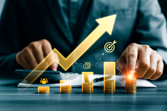 Business financial growth concept with professional pressing calculator and touching coin stack beside rising digital arrow chart showing revenue increase investment strategy and profit performance