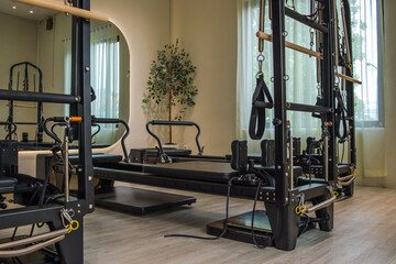 Obraz premium Luxury Pilates Studio Interior Featuring Premium Workout Apparatus and Minimalist Decor