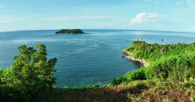 Aerial view Drone camera of seashore rocks in summer season, Beautiful sea in Phuket Thailand, Amazing sea waves crashing on rocks seascape in Phuket island Thailand