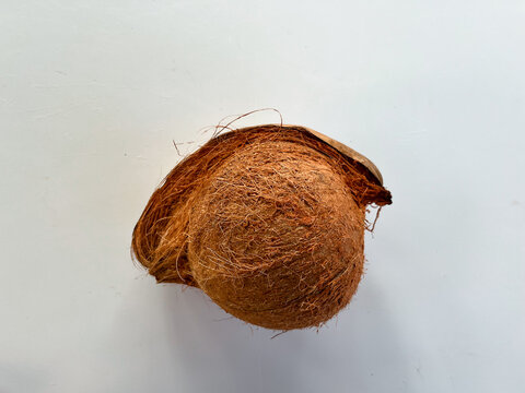 Coconut husk with fibrous texture on white background