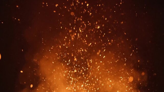 Intense fire embers rising from burning flames sparks flame night glowing heat