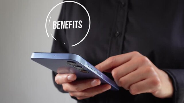 Person holds phone with focused attention. Finger taps screen with deliberate motion. Circular graphic displays word "Benefits" above device. Ideal for business or tech marketing visuals