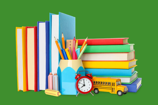 School supplies are neatly arranged alongside colorful books