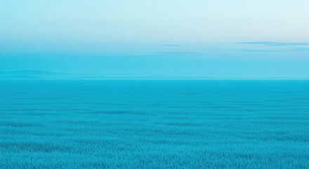 Fototapeta premium Vast Cyan Ocean Expanse Meets Pale Blue Sky