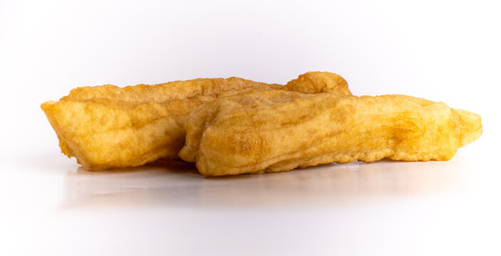 Pair of crispy savory fried dough sticks cakwe youtiao isolated on white