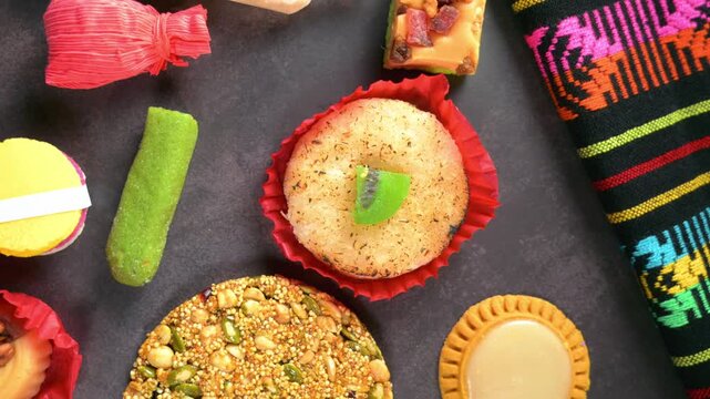 Variety of traditional Mexican sweets on dark background top view